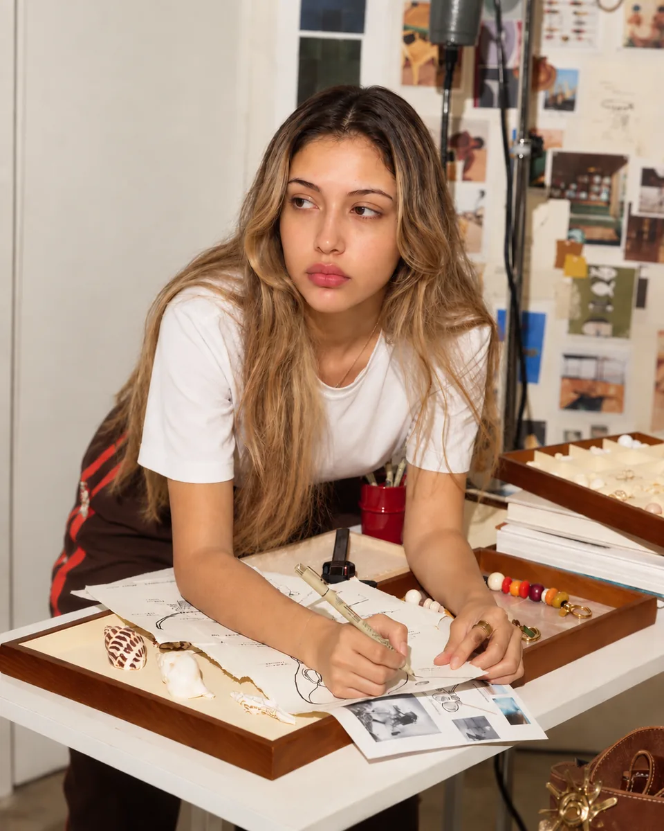 At the bench &mdash; drawing a mark over a reference wall, samples and swatches laid out