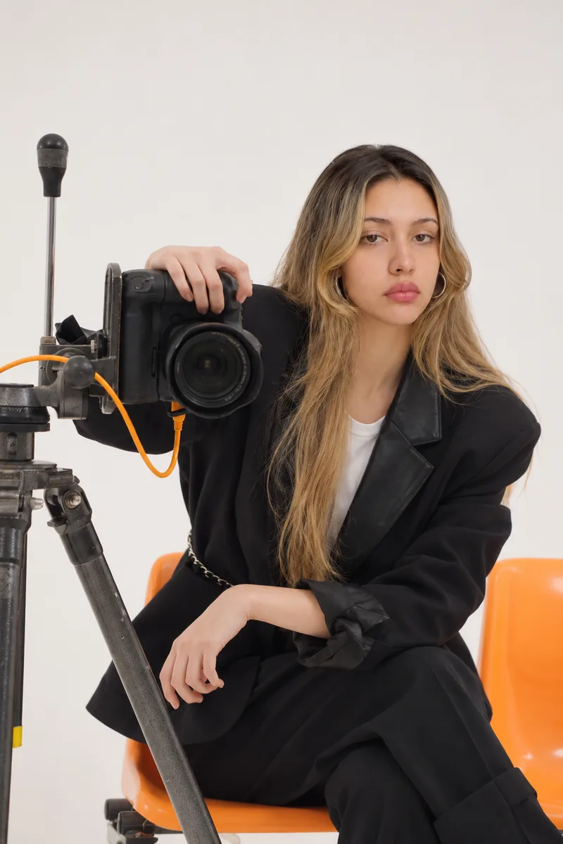 Behind the camera &mdash; a body on a tripod head, tethered, waiting on the next frame