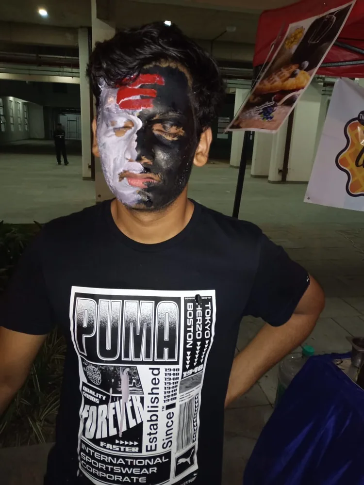 A guest in face paint at an event